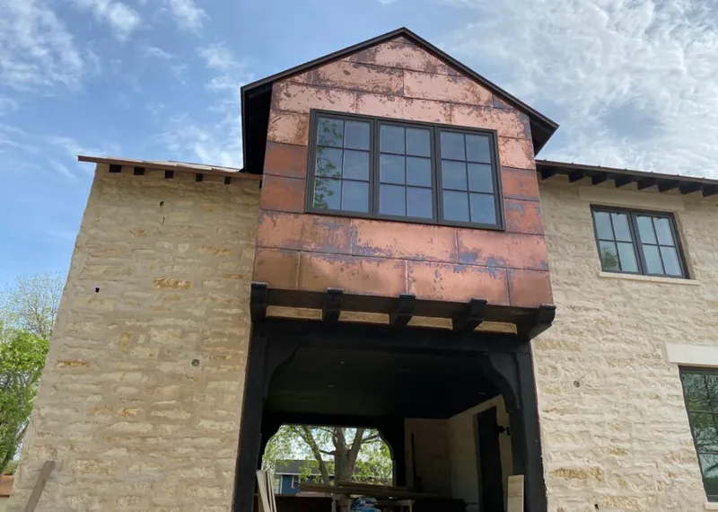 Copper metal panel facade on a stone building for Metal Roof Coating in West Windsor